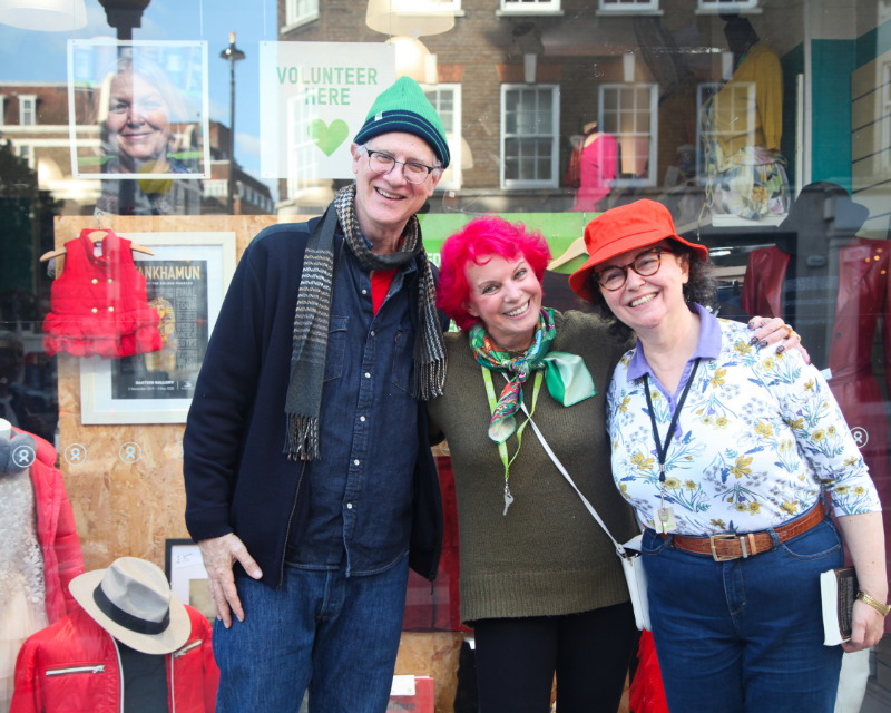 Smiling shop volunteers