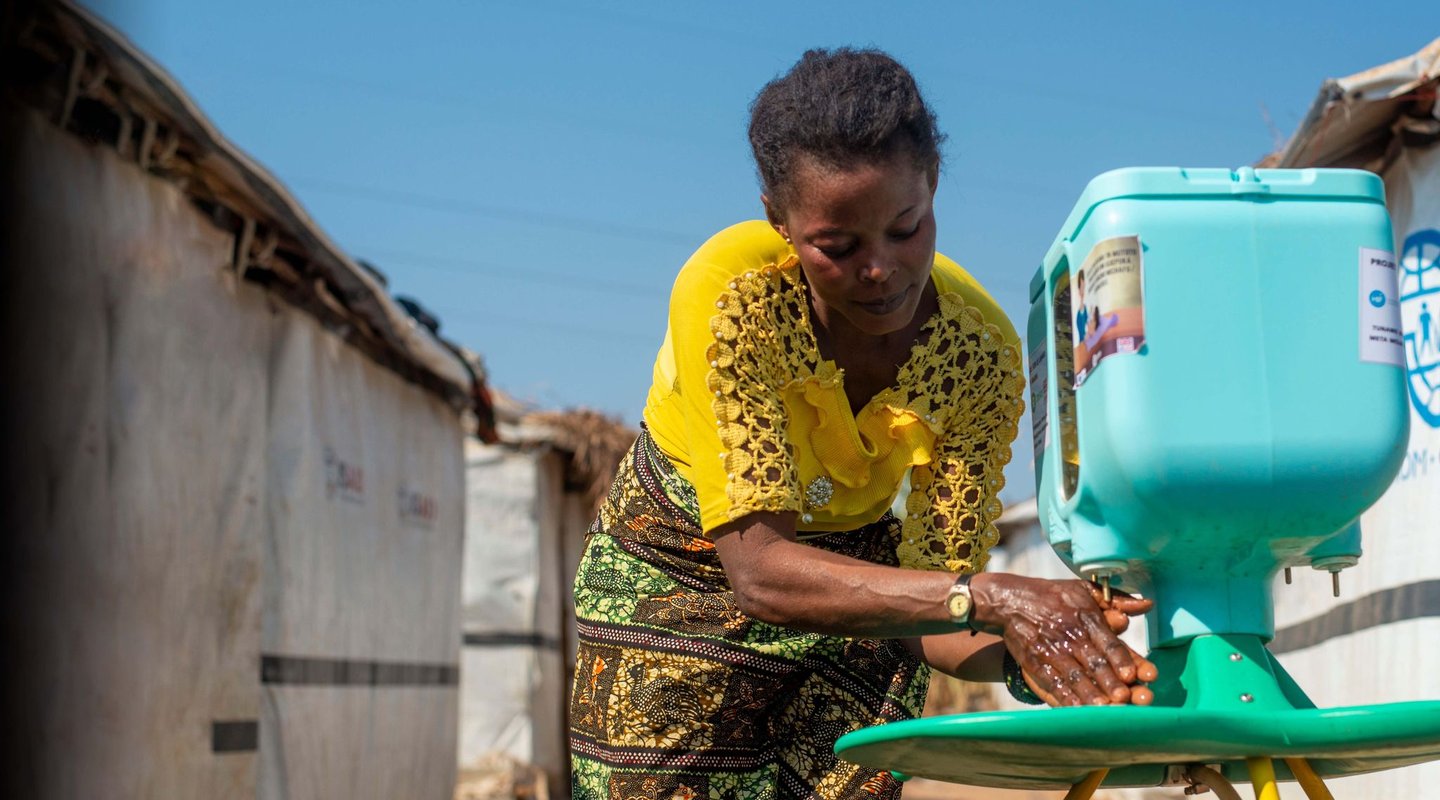 Lumbumba uses the new handwashing kit.