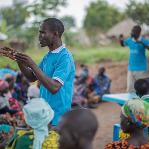 David speaks to members of his community about gender equality.