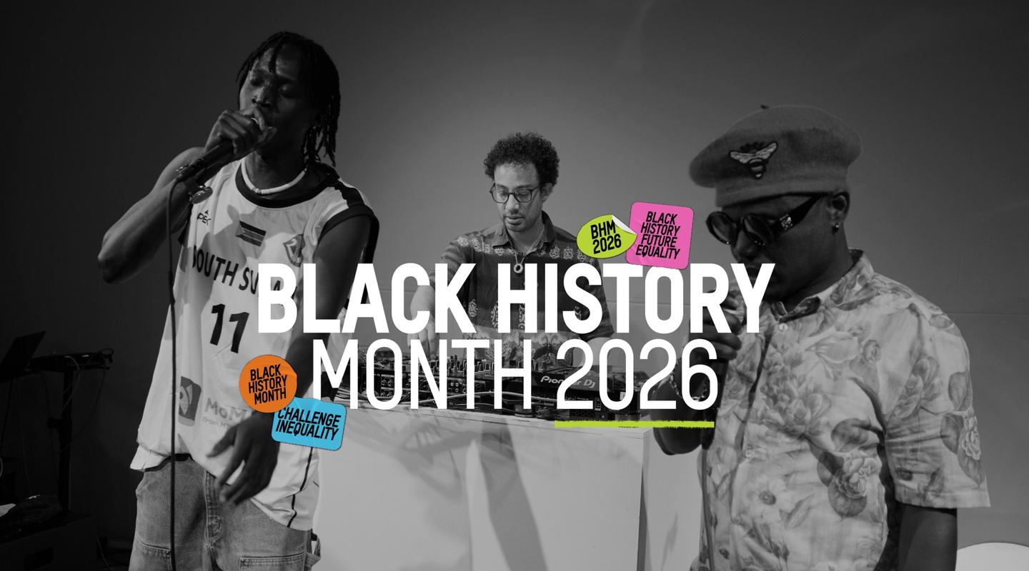 Black and white photograph three men performing a song. One is a DJ at his decks and two are stood in front holding microphones to their mouths. The text over the image reads Black History Month 2026