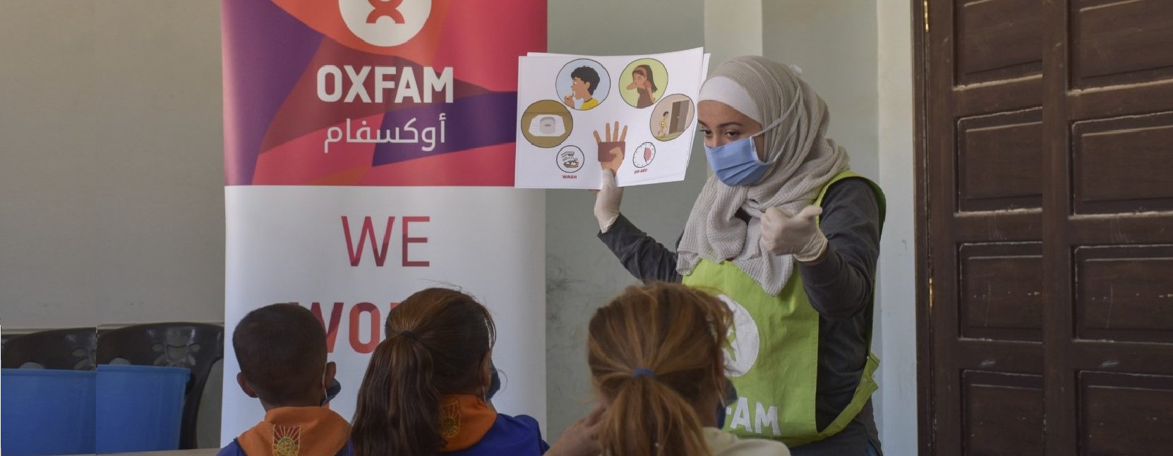 An Oxfam volunteer tells schoolchildren in Aleppo about the four key times for handwashing, based on the Mum's Magic Hands curriculum