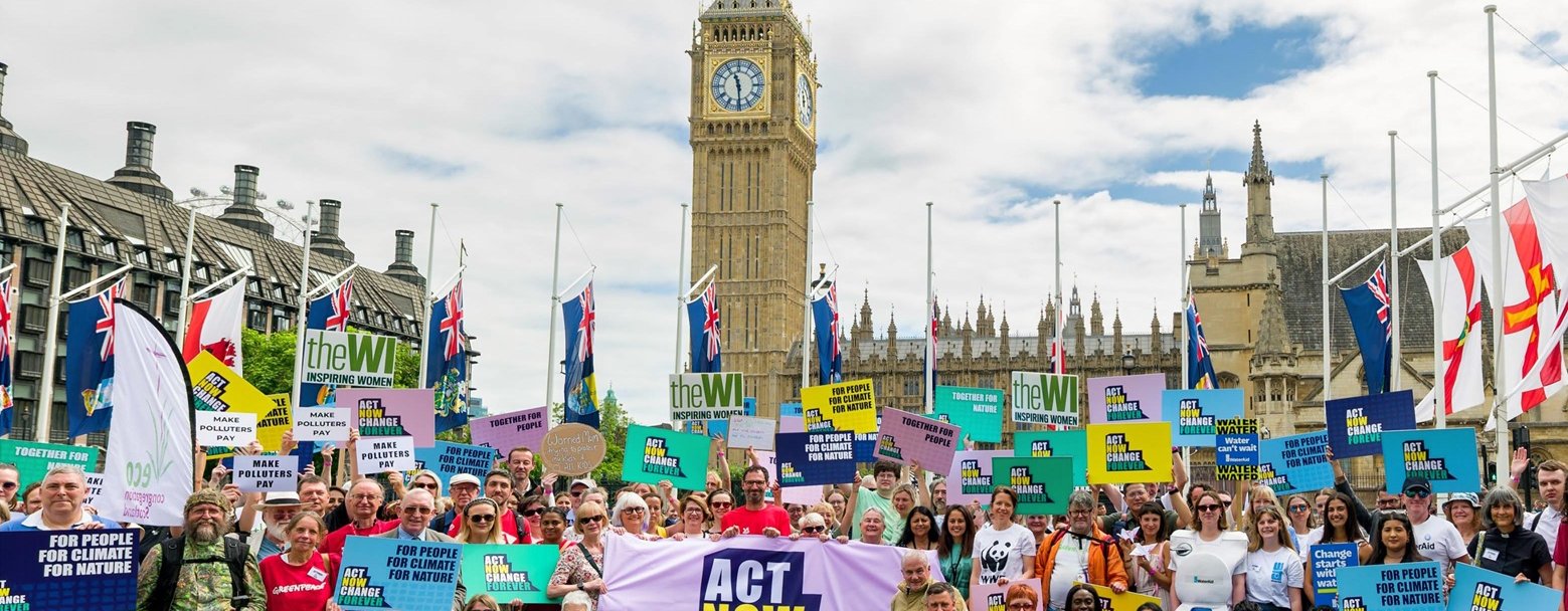 The Climate Coalition outside of Westminster all holding banners