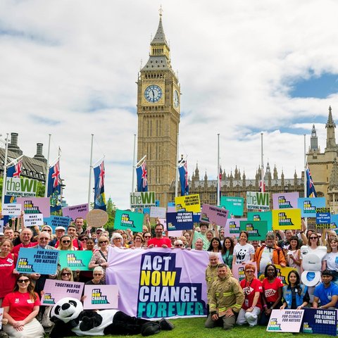 The Climate Coalition outside of Westminster all holding banners