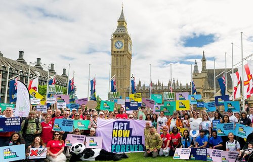The Climate Coalition outside of Westminster all holding banners