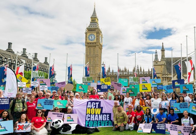 The Climate Coalition outside of Westminster all holding banners
