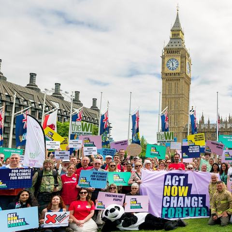 The Climate Coalition outside of Westminster all holding banners