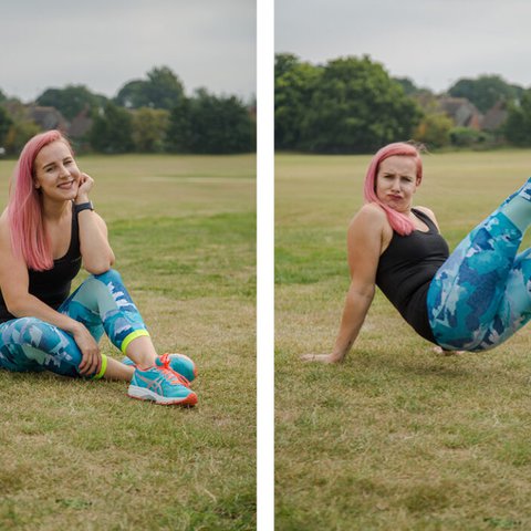 Zara wears blue leggings and a black strap top and kicks the air with blu trainers outside on the grass