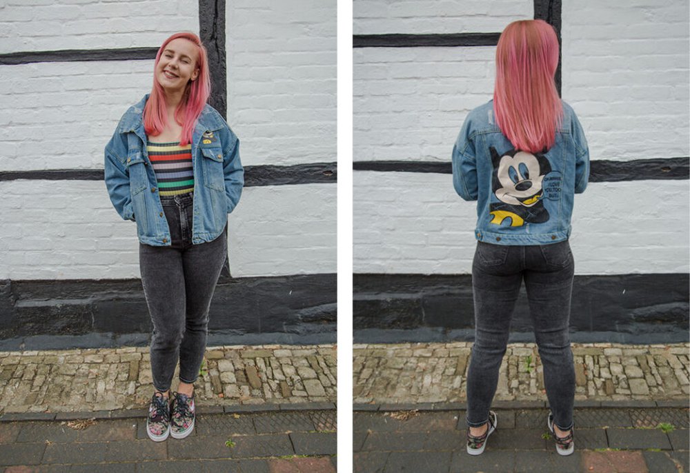 Zara Canfield wears second-hand jeans, a denim Mickey Mouse jacket and Nike trainers