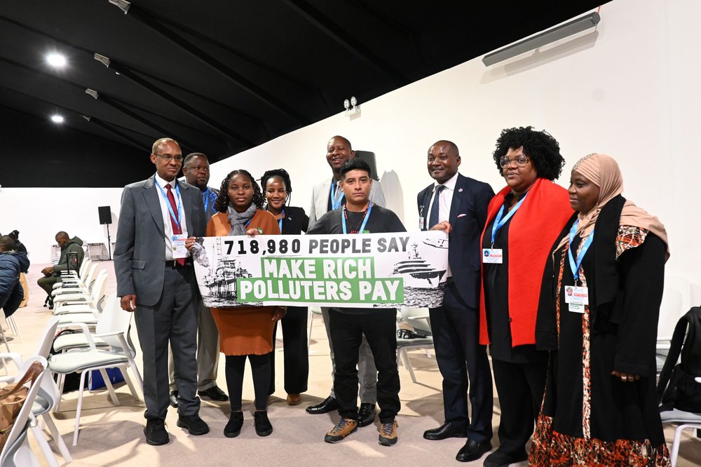 Activists present Make Rich Polluters Pay petition