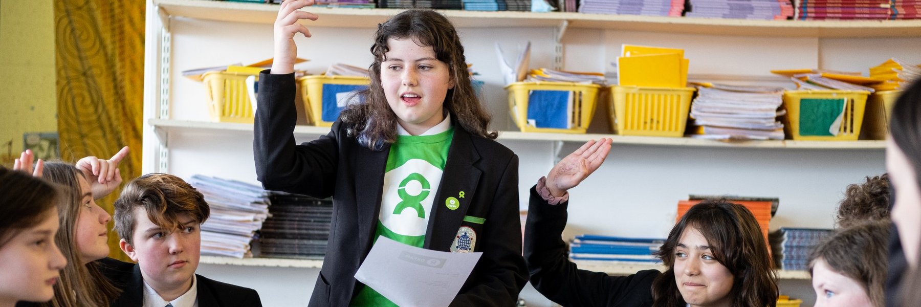 Young people in a classroom in the UK discuss ideas for taking action on global issues.