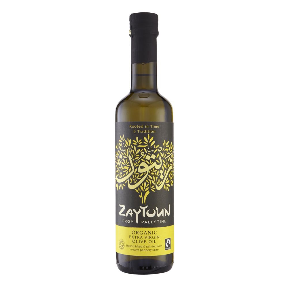 a glass bottle of Zaytoun Olive Oil, features an illustrative yellow tree on the front with the text' Rooted in Time & Tradition' above it.