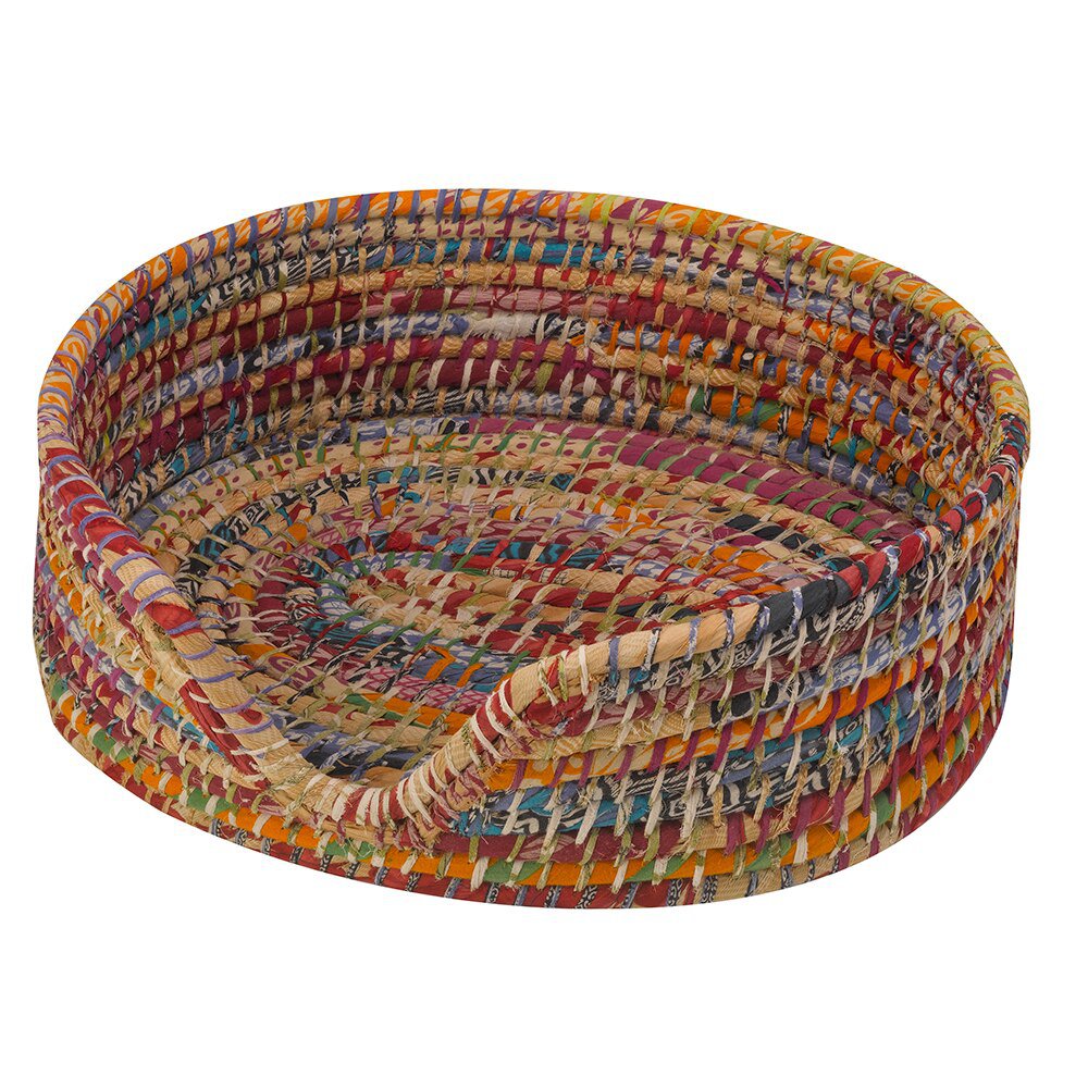 A brightly coloured cat or dog basket made from recycled saris