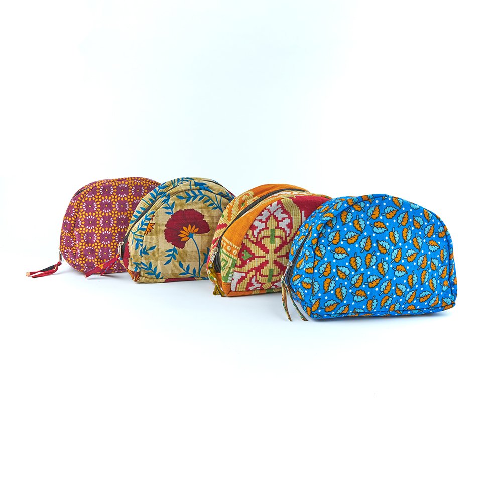 Four colourful patterned small washbags in a line