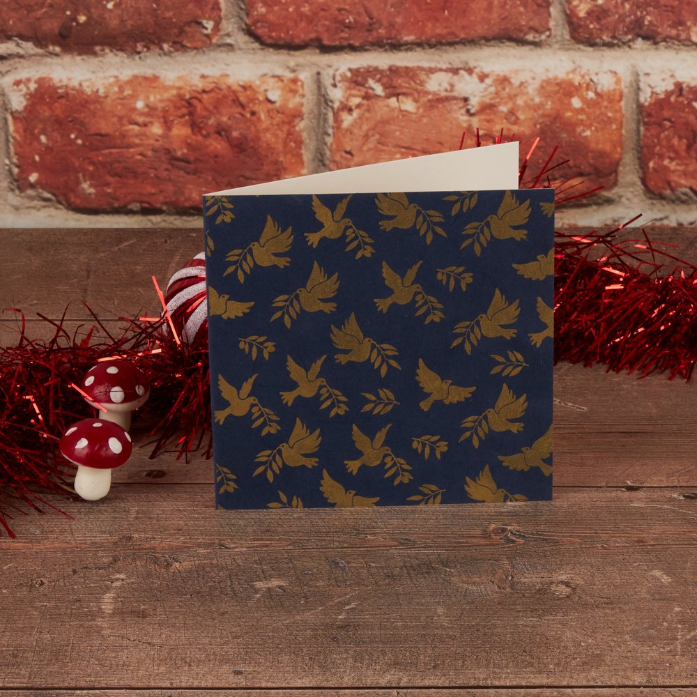 Gold Doves on a navy background Fair Trade Single Christmas Card