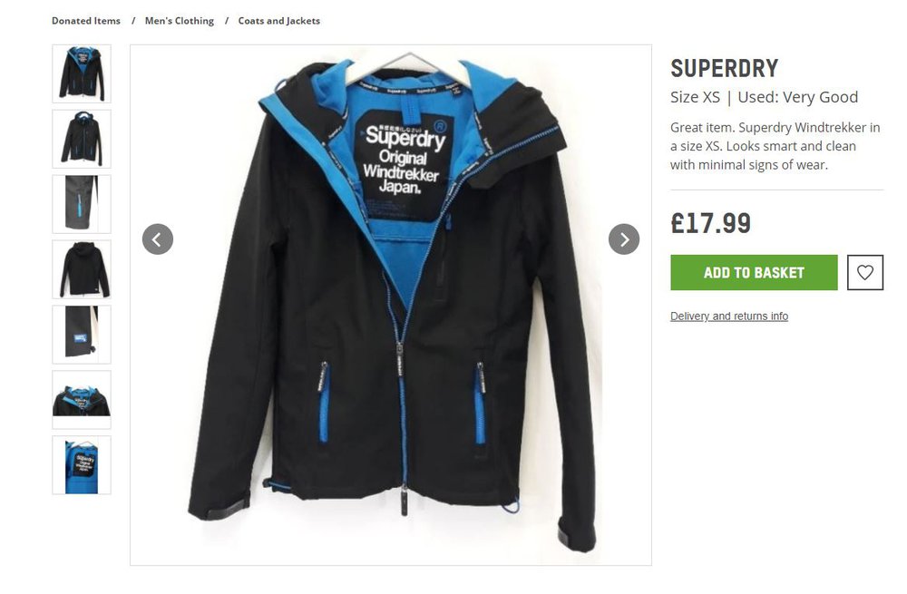 A black and blue waterproof jacket with a large Superdry label inside