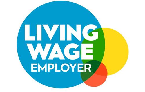 Living Wage Employer logo featuring the words ‘Living Wage Employer’ in white text inside a large blue circle, overlapped by smaller circles in yellow, green, and orange.