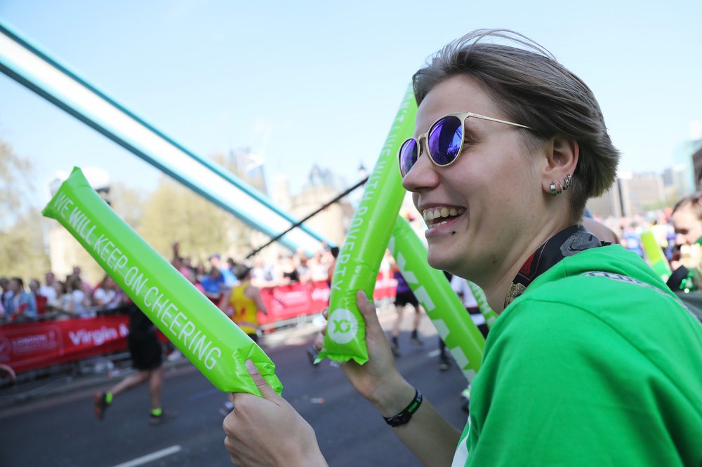 Oxfam supporters cheer on runners taking part in the 2018 London Marathon for Oxfam.