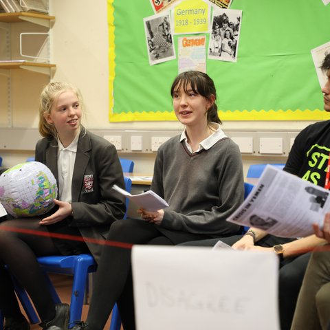 Pubils in uniforms in a classroom workshop
