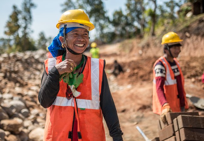 Female construction worker Kaile (20yrs) stands in a housing site in Kharanitaar village, Nepal