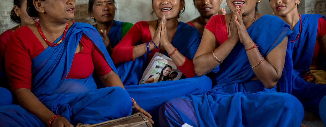 A group of women singing at a community centre in Nepal