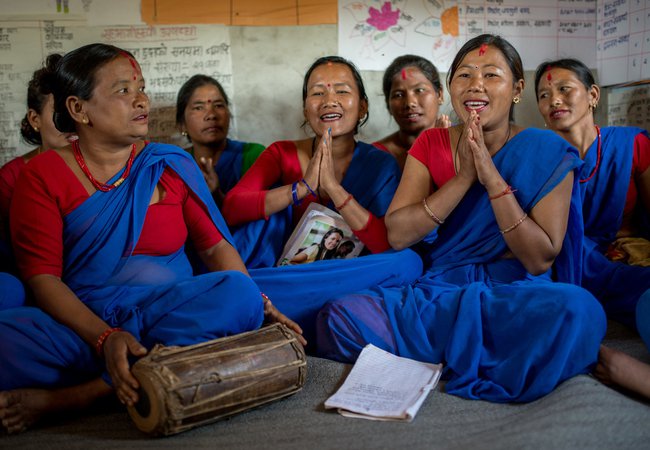 A group of women singing at a community centre in Nepal