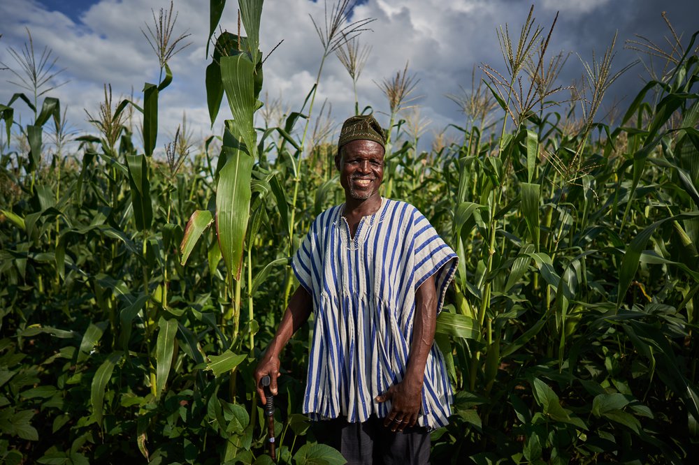 Seidu stands proudly in his maize farm in Ghana.