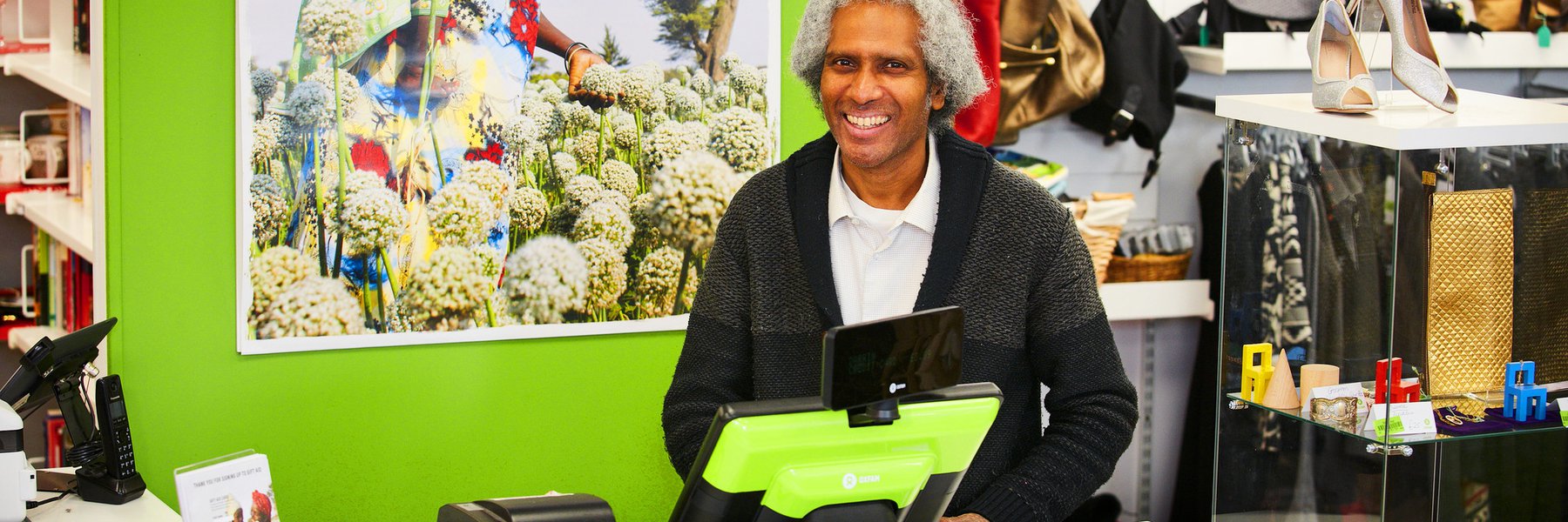 Regular volunteer, Johnson, at Bethnal Green Oxfam shop