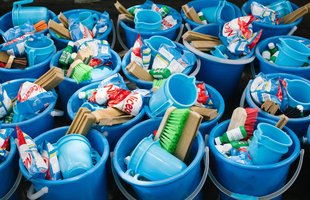Hygiene kits ready for distribution in Mozambique. Each kit consists of a bucket filled with useful items such as a water jug, soap, brush and washing powder.