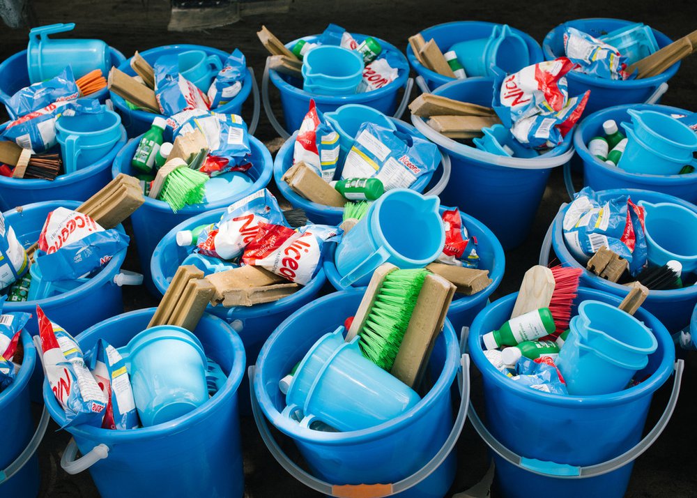 Hygiene kits ready for distribution in Mozambique. Each kit consists of a bucket filled with useful items such as a water jug, soap, brush and washing powder.