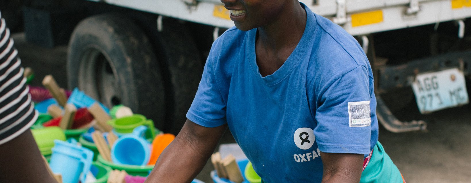 Elsa, 39 distributing Oxfam hygiene kits