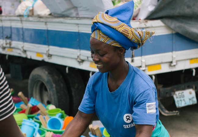 Elsa, 39 distributing Oxfam hygiene kits