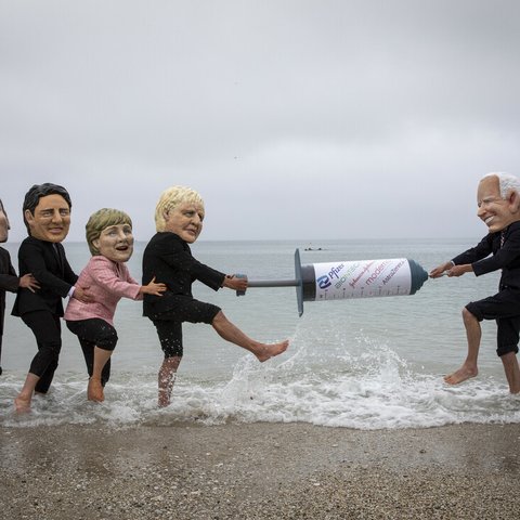 Campaigners from Oxfam and The People’s Vaccine Alliance pose as world leaders at the G7 summit in Cornwall, 2021.