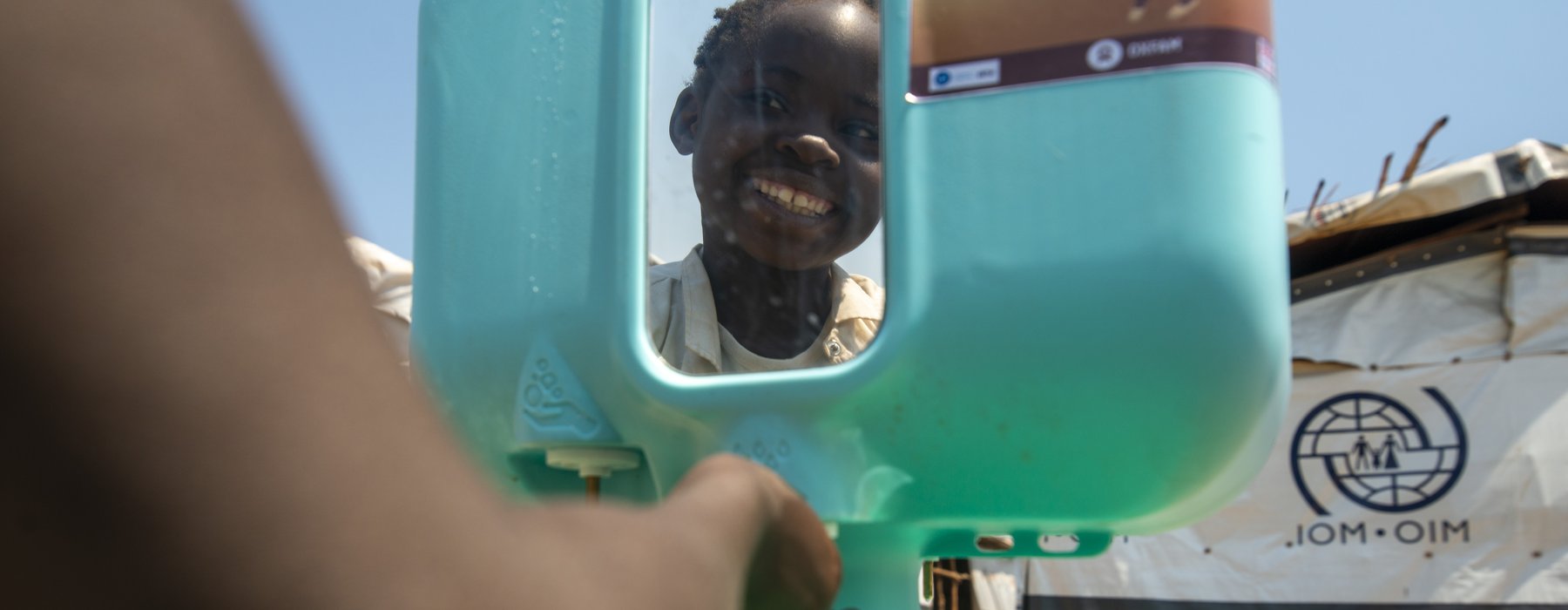 Kapinga washes his hands.