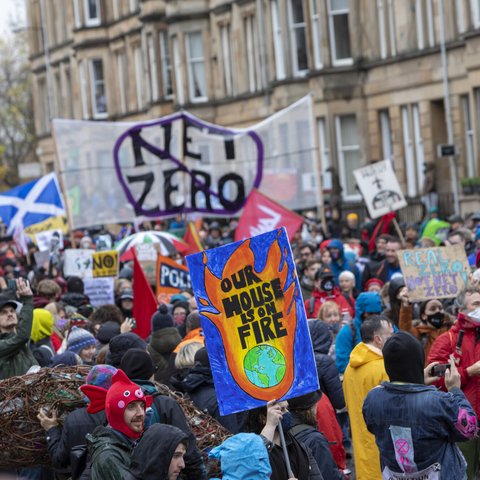 Campaigners marching in Glasgow as part of the Global Day of Climate Action in November 2021