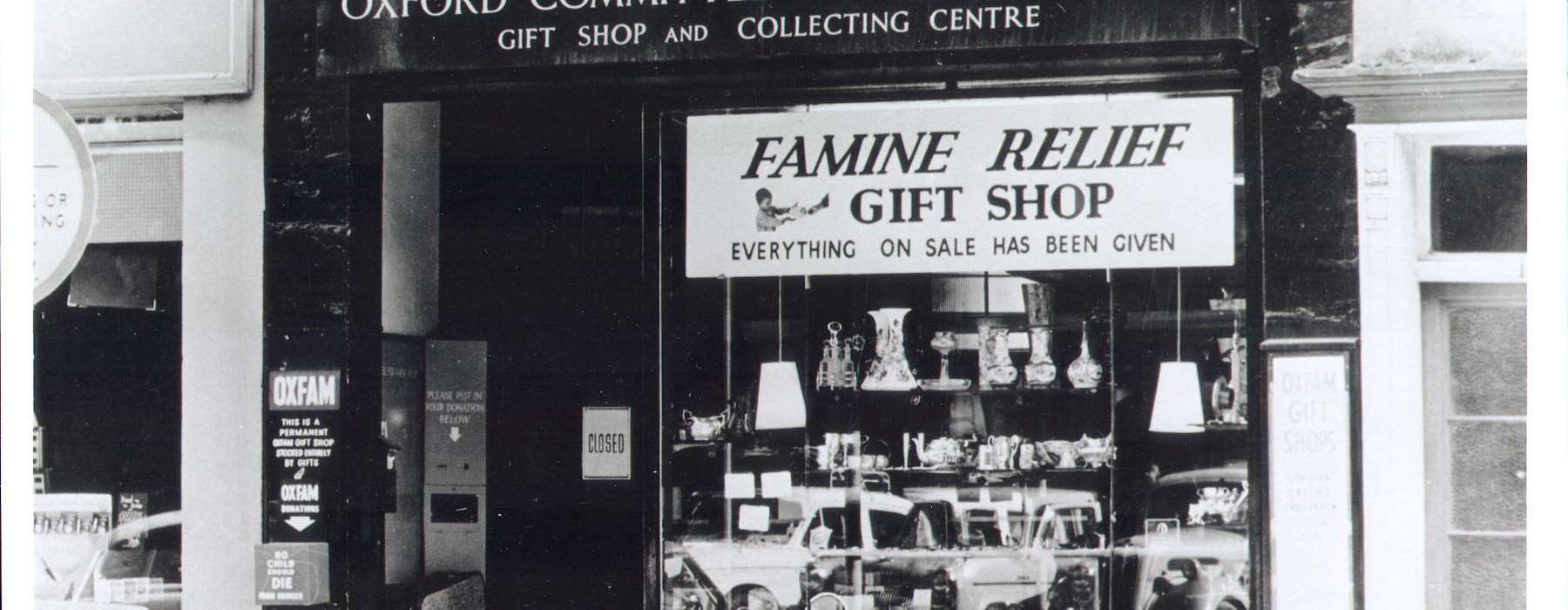 A black and white photo of an Oxfam shop in the 40s in Oxford