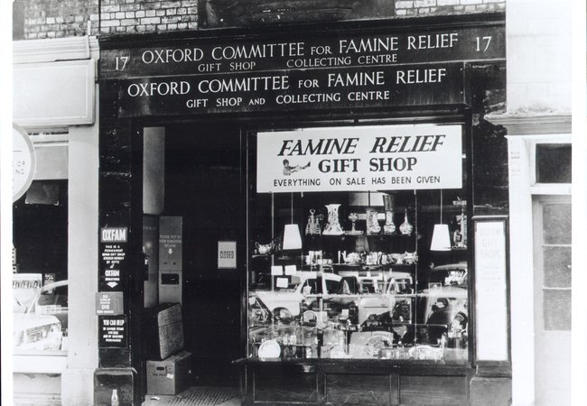 A black and white photo of an Oxfam shop in the 40s in Oxford