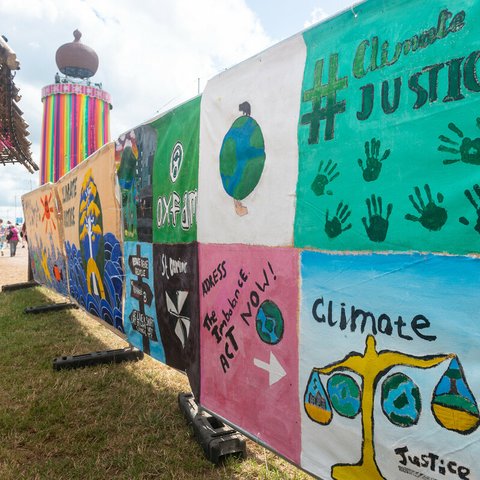 School climate justice banners hanging at the Glastonbury festival