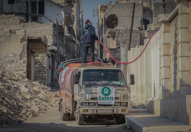 An Oxfam lorry delivering water to shelters in Aleppo city, Syria.