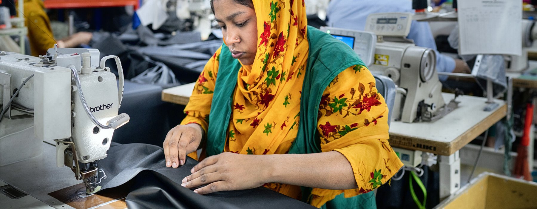 Textile workers working inside a garment factory in Savar, Bangladesh.