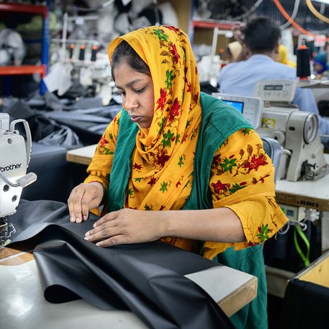 Textile workers working inside a garment factory in Savar, Bangladesh.