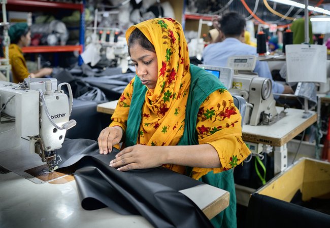 Textile workers working inside a garment factory in Savar, Bangladesh.