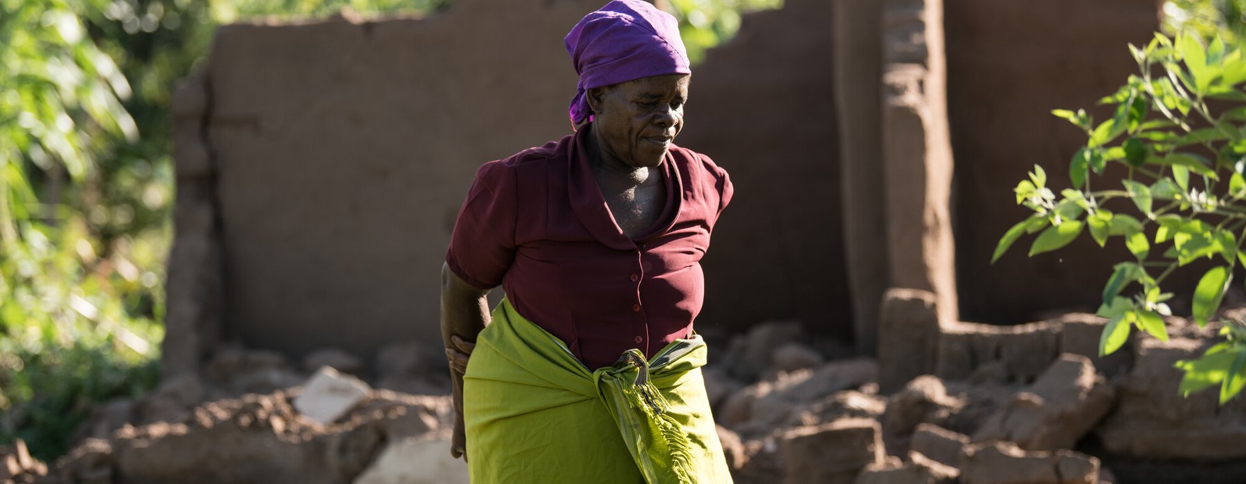 65-year-old Ligineti Nayinayi is outside her house damaged by Cyclone Freddy in Phalombe southern Malawi