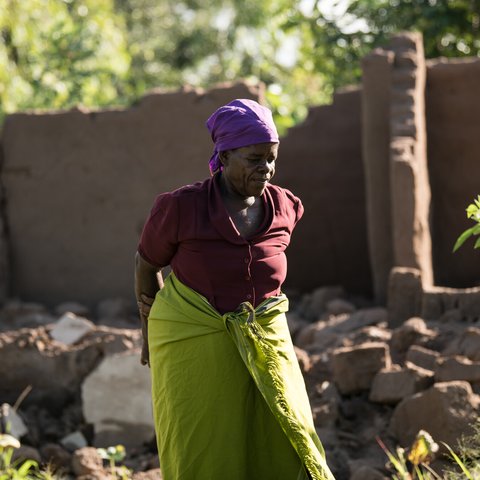 65-year-old Ligineti Nayinayi is outside her house damaged by Cyclone Freddy in Phalombe southern Malawi