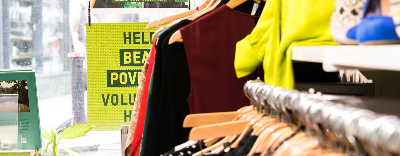Donated clothing on display in shop interior