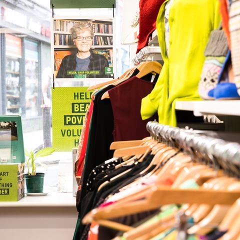 Donated clothing on display in shop interior
