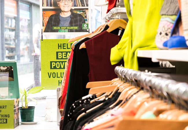 Donated clothing on display in shop interior