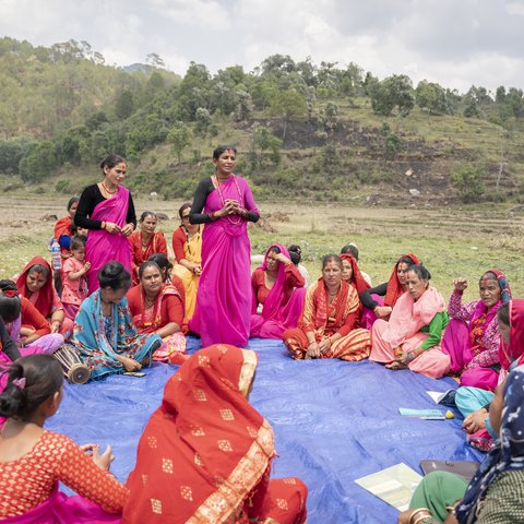 Tikeshwori Malla (27) and Ganga Devi Malla (53) address the members of Farmer Field School during a group’s meeting in a village in Jorayal Rural Municipality, Nepal.