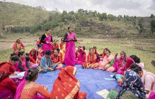 Tikeshwori Malla (27) and Ganga Devi Malla (53) address the members of Farmer Field School during a group’s meeting in a village in Jorayal Rural Municipality, Nepal.