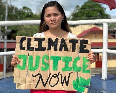 Marinel holding a protest card.