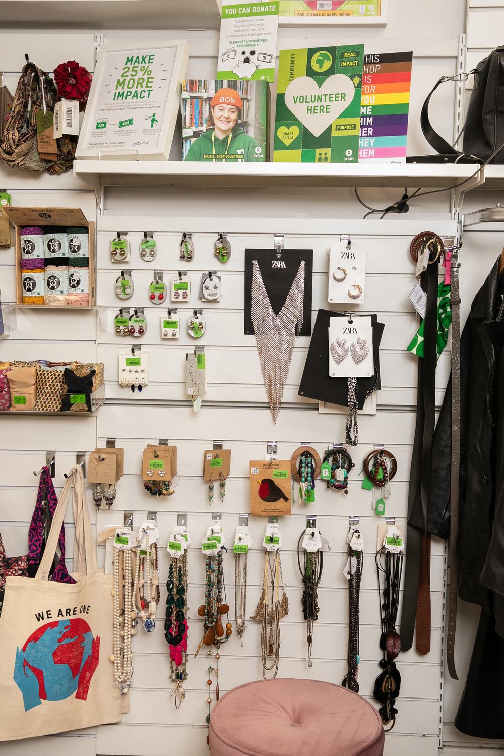 Lots of necklaces, earrings, belts and bag in Oxfam shop
